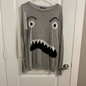 Grey monster Forever 21 sweater. Like new condition. Size small, fits like M.